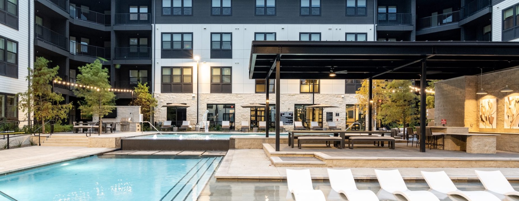 pool with seating inside and outside the pool with entertainment areas