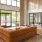 a large room with a large glass wall and a large couch